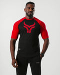 Man wearing a black and red sports outfit with a logo on a white background

