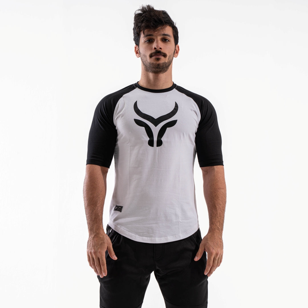 Man wearing a white and black sports jersey with a logo on a white background

