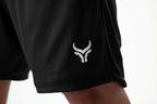 Black shorts with a white logo on a white background
