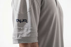 Gray sports jersey with 'TAUR' logo on sleeve against a white background