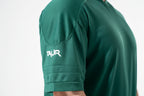 Green athletic shirt with 'TAUR' logo on a white background