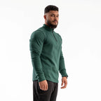 Man wearing a green long-sleeve shirt on a white background