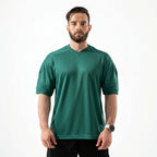 Man wearing a green sports jersey on a white background

