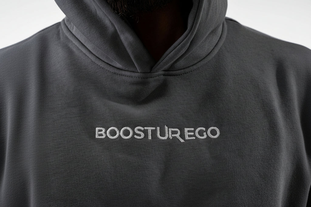 Black hoodie with 'BOOSTUR EGO' logo on a plain background

