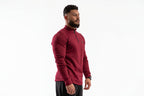 Man wearing a red long-sleeve athletic shirt on a white background