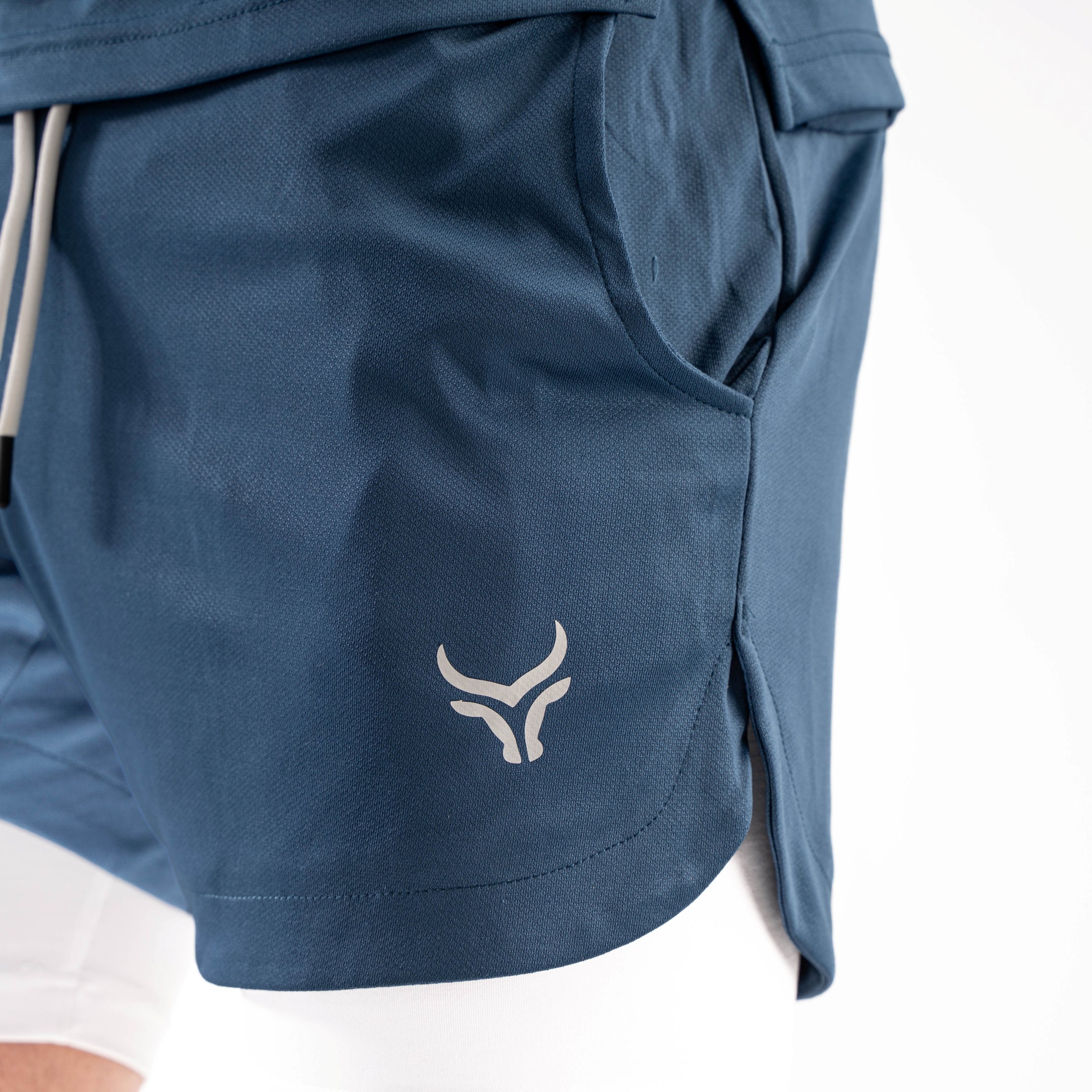 Blue shorts with a logo on a white background

