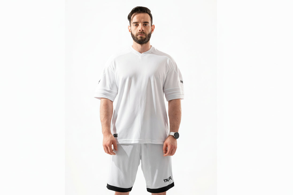 Man wearing a white t-shirt and shorts with a brand logo on a white background

