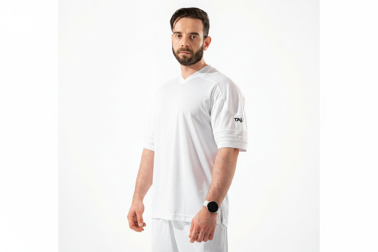 Man wearing a white t-shirt with a logo on a white background

