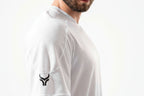 White athletic shirt with a logo on the sleeve against a white background

