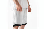 White shorts with black trim worn by a person on a white background