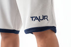 Close-up of a white sports jersey with 'TAUR' logo on a white background